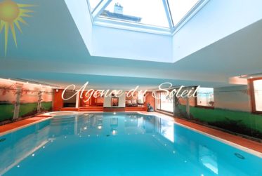 Somptueux lot de 4.5 pièces + 3.5 pièces + chambre de service, jardin, piscine privée au cœur de Crans !